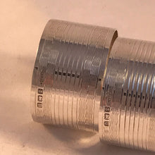 Load image into Gallery viewer, Pair Of Silver Napkin Rings with Striped Pattern and Rectangular Cartouche Birmingham 1944